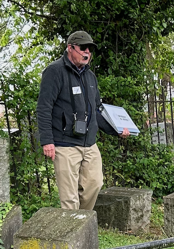 David Heiby leading a tour group through the historic Presbyterian Cemetery in Alexandria, Virginia.